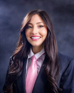 Businesswoman smiling in professional attire at Privy Clear.